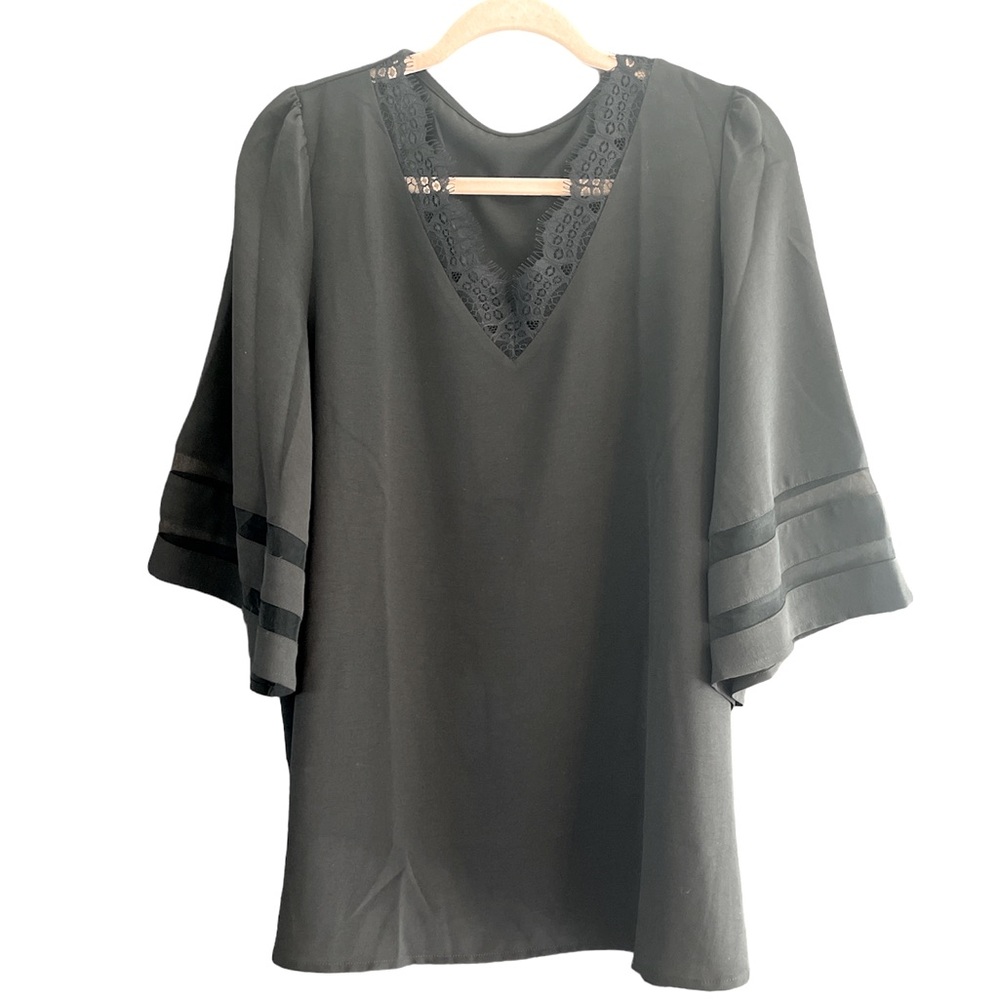 Black polyester blouse,sheer stripes in the bottom of the sleeve and lace V-neck